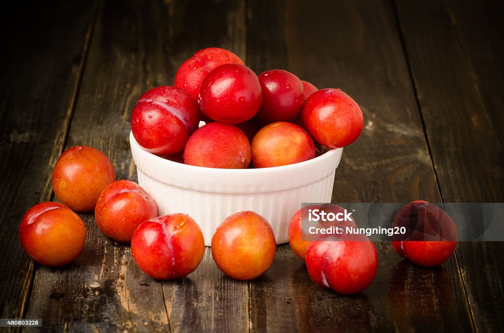 Fresh plum Fresh plum (Julee) on wooden background,healthy food 2015 Stock Photo