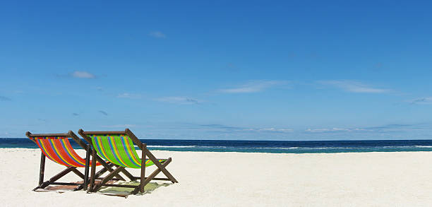 istock Beach chair on sand beside nice sea, Summer time concept 480808654