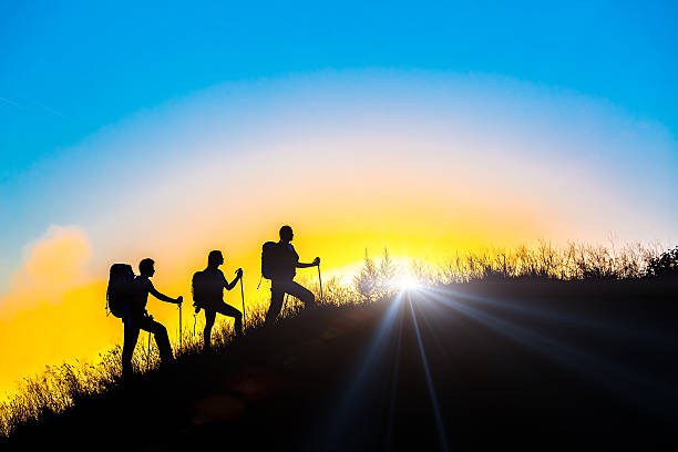 istock People meeting sunrise on a team building session 480809072