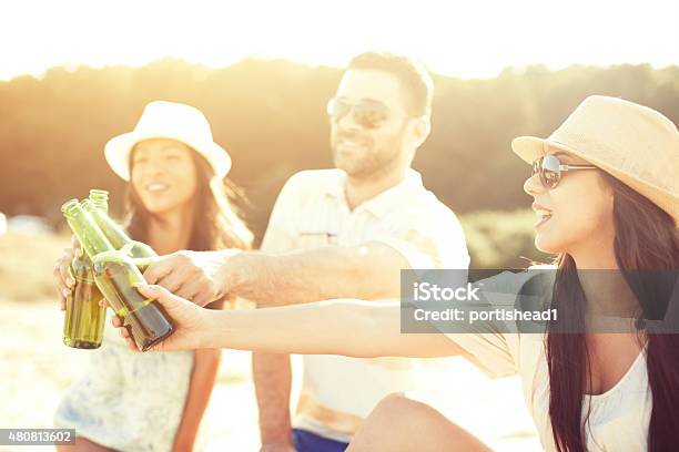 Young People Having Fun At Beach Party Stock Photo - Download Image Now - 20-24 Years, 20-29 Years, 2015