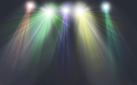 light colored spotlights on a dark background