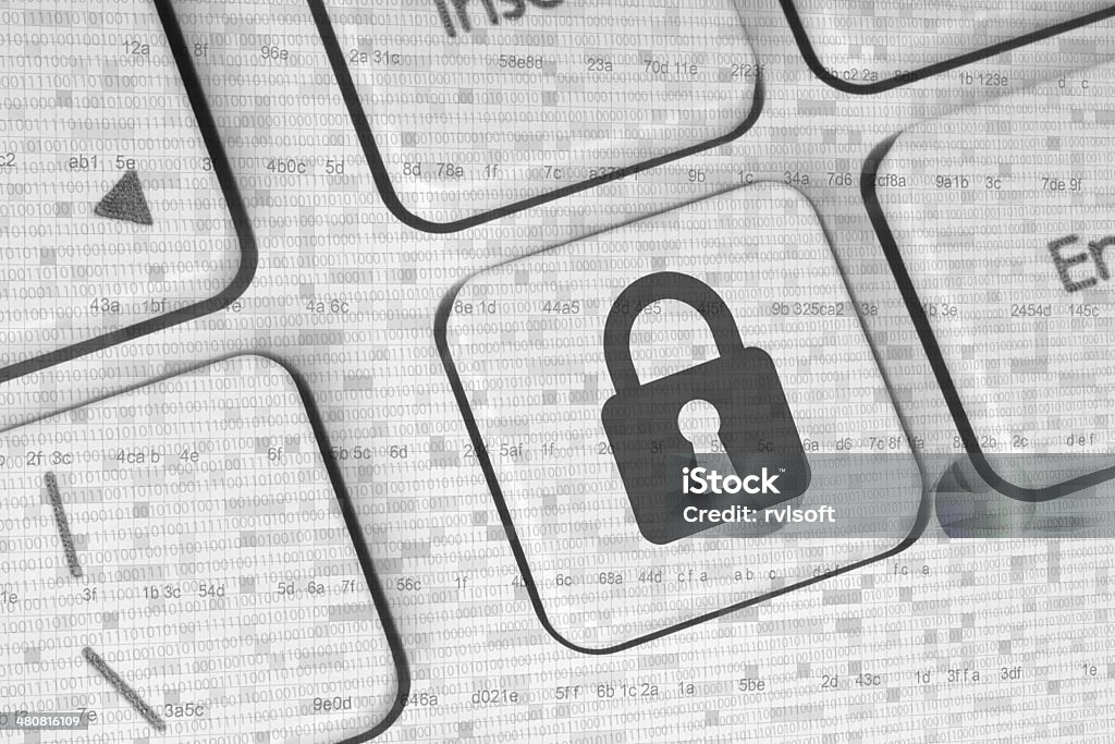 Lock on a white keyboard Lock on a white keyboard, security concept Abstract Stock Photo