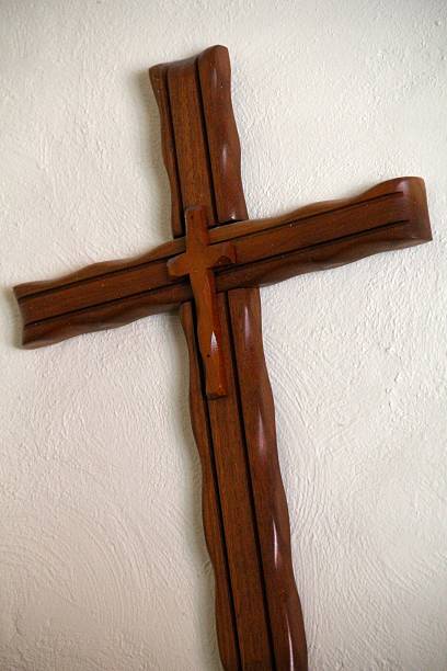 istock Angled Hand Made Wooden Cross on a Wall 480816663