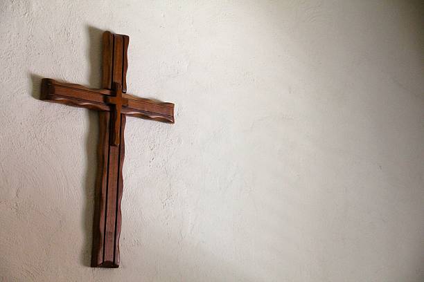 istock Handmade Wooden Cross on a Wall Left Adjusted 480816771