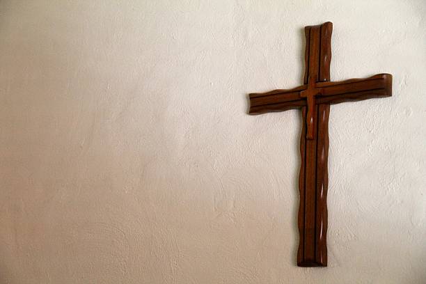 istock Handmade Wooden Cross Hanging on a Wall 480816821