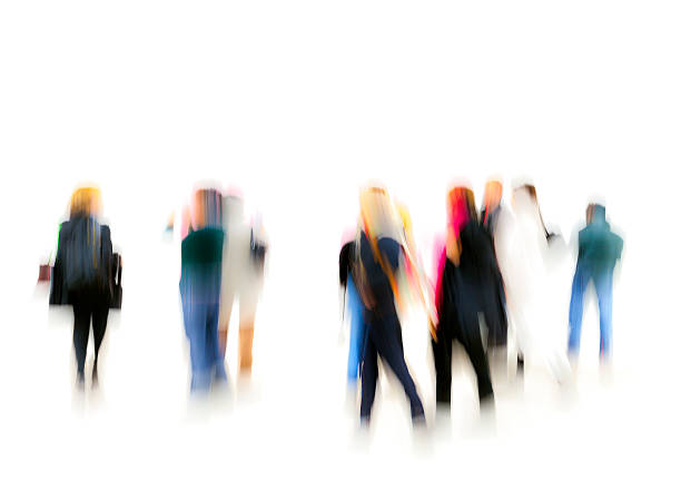 a large group of colorfully dressed, generic, casual, unrecognizable, blurred people standing on white background