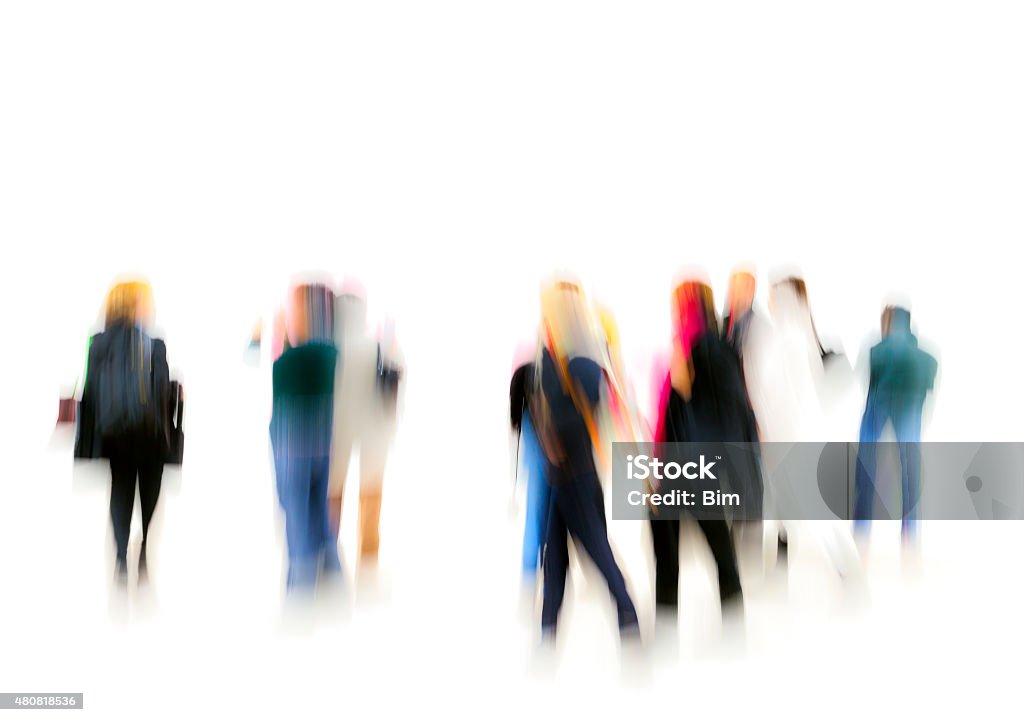 Large Group of Colorful People On White Background a large group of colorfully dressed, generic, casual, unrecognizable, blurred people standing on white background People Stock Photo
