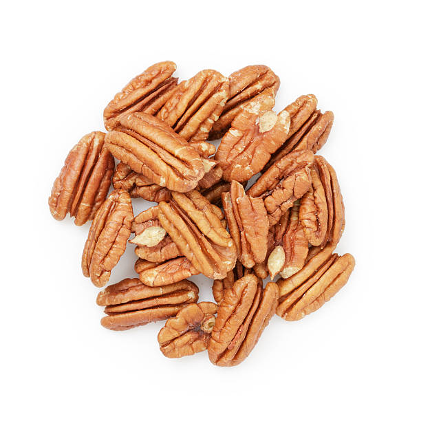 istock Pecan halves from above isolated on a white 480819118