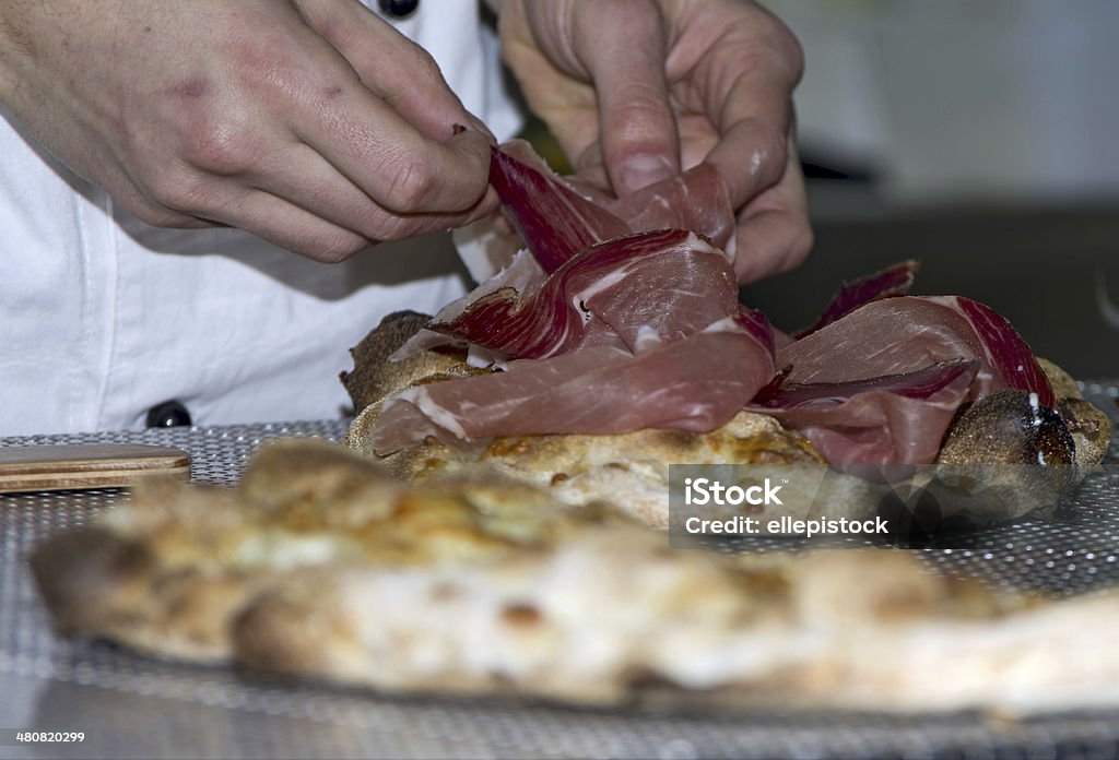 Whites pizzas Whites pizzas cooked and stuffed with bacon, artichokes,ham and mozzarella cheese Oven Stock Photo