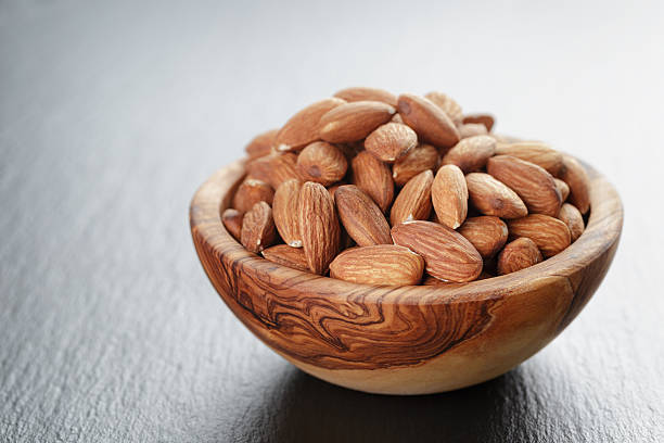 istock roasted almonds in bowl on slate background 480822540