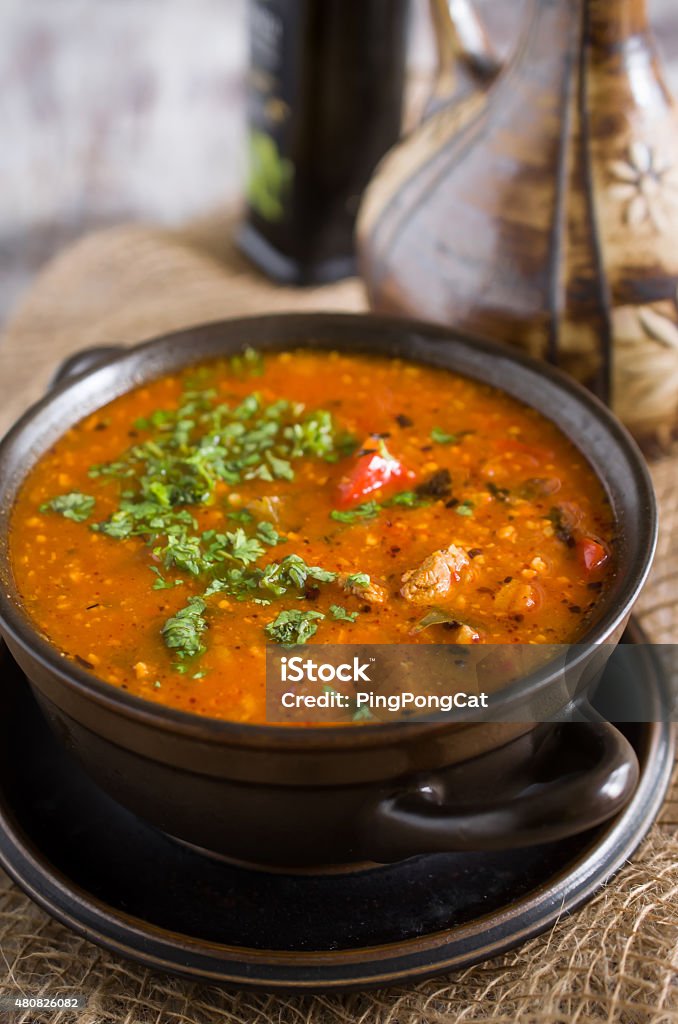 Traditional Georgian stewed meat soup Bowl of hot stewed pork soup with rice, vegetables and hazelnuts Hazelnut Stock Photo