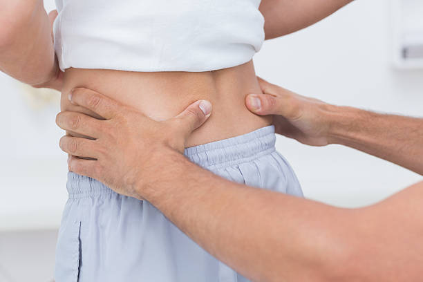 istock Doctor examining his patient back 480827398