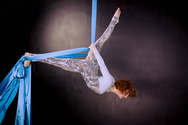 istock Young gymnast training on aerial silk 480827454