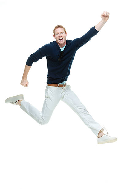 istock Cheerful casual man jumping and cheering 480832086