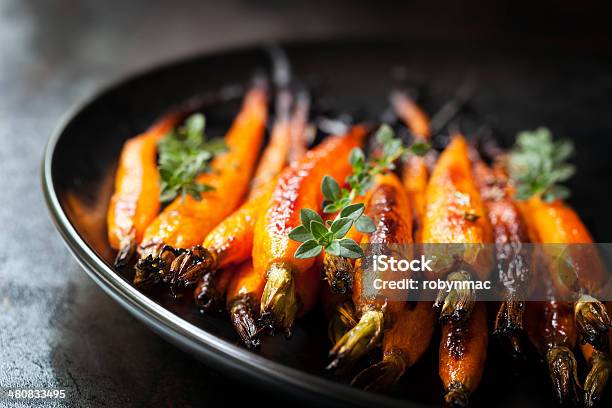 Baked Baby Carrots With Thyme Stock Photo - Download Image Now - Carrot, Roasted, Glazed Food