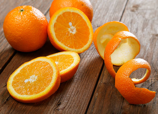 istock Oranges and dried peel on a rural table 480836384