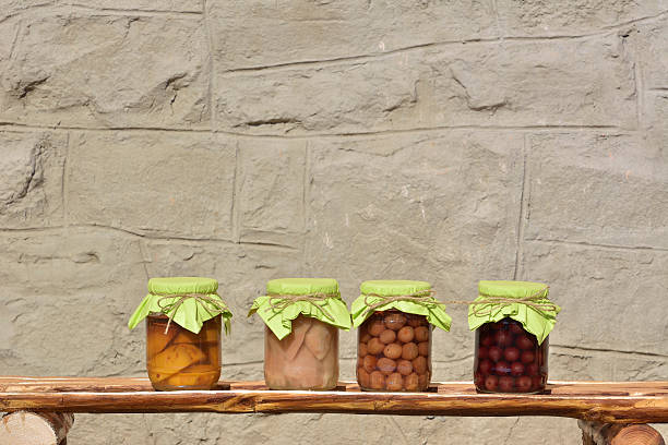 Jars with fruity compotes . Preserved fruits.