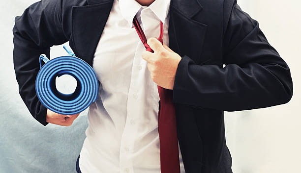 istock business man with yoga mat , exercise concept 480841184