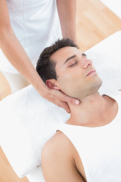 istock Man receiving neck massage 480843248
