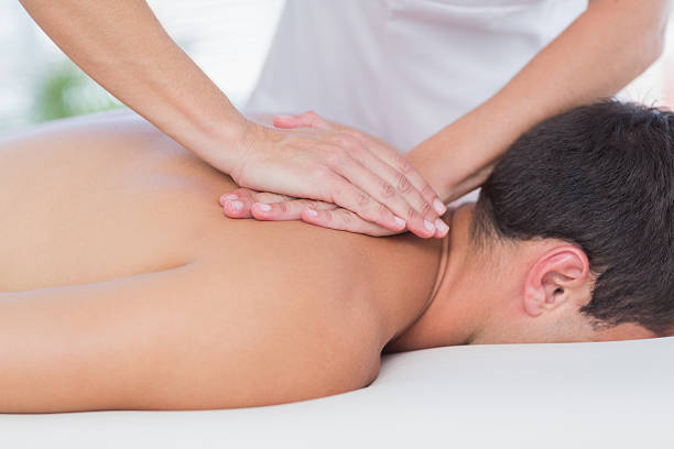 istock Physiotherapist doing back massage to her patient 480844650