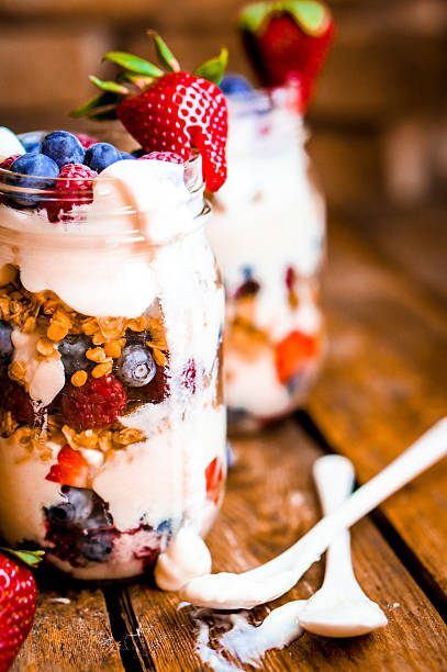 istock Granola Parfait with yogurt and berries on rustic background 480844987