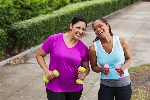 istock Women exercising in park 480847487