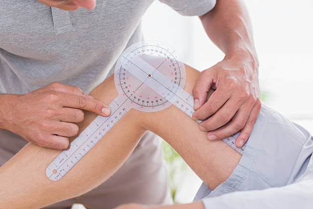 istock Doctor examining man leg 480847978