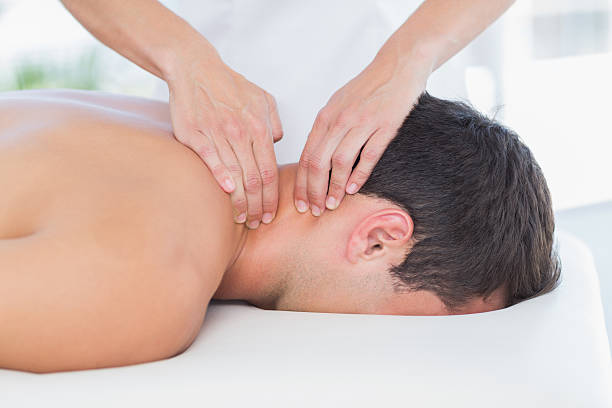 istock Physiotherapist doing neck massage to her patient 480848846