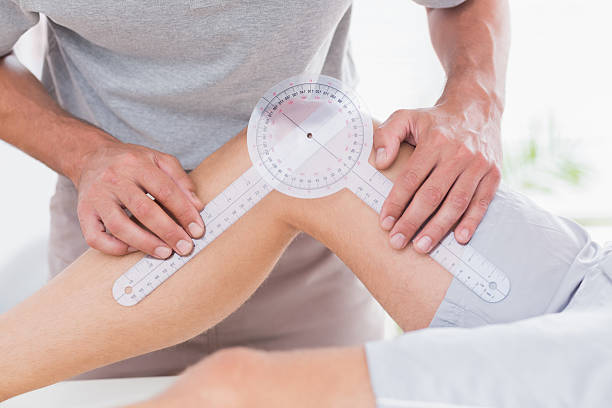 istock Doctor examining man leg 480849044
