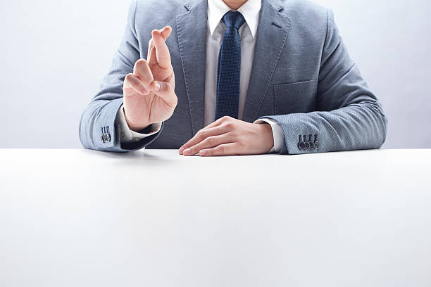 istock Businessman Fingers Crossed 480849347
