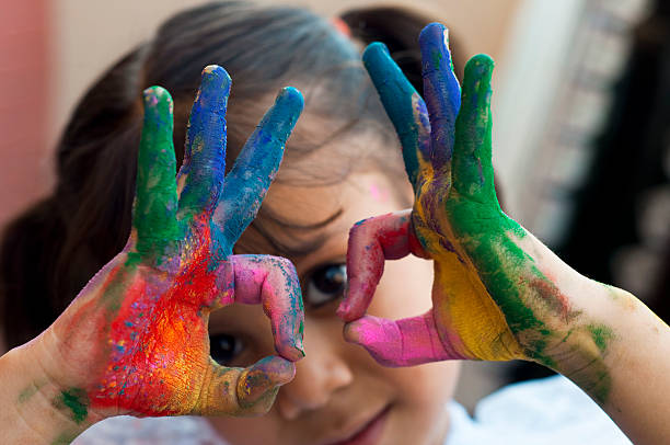 istock Small girl playing with colors 480849667