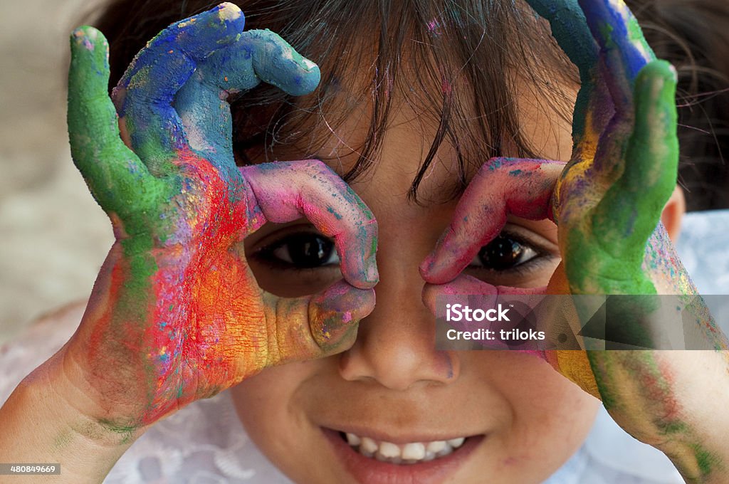 Small girl playing with colors Playing with colors Child Stock Photo
