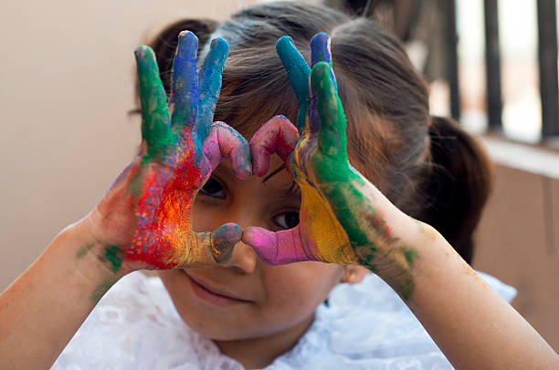 istock Small girl playing with colors 480849675