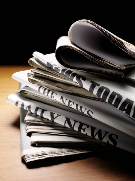 istock Daily Newspapers on a Desk 480855573