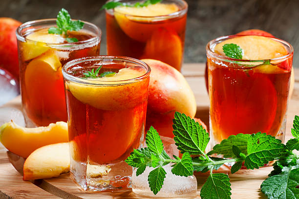 istock Ice Peach Tea with pieces of fruit, ice and mint 480857756