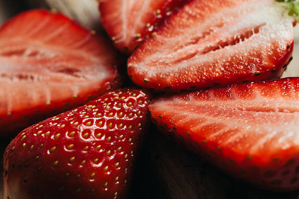 istock strawberry close up on wood table 480857804