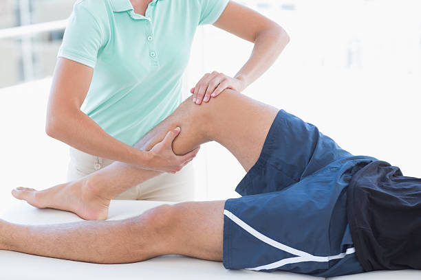 istock Doctor examining man leg 480858964