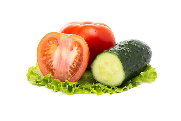 istock ripe tomatoes and cucumber in a salad leaf 480861146
