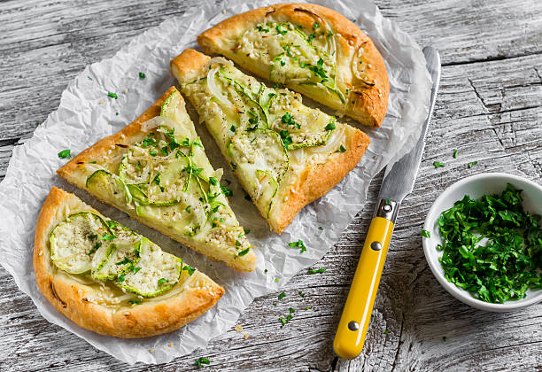 istock pizza with zucchini, onion, cheese and sesame seeds 480864652