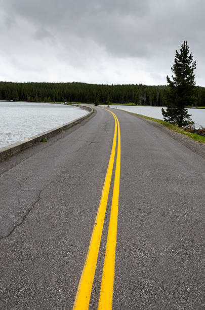 istock road on the Yellowstone lake 480865376
