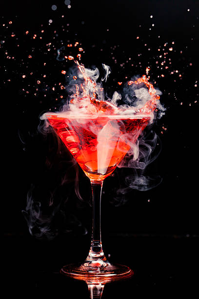 istock red cocktail with splash and ice vapor 480865769