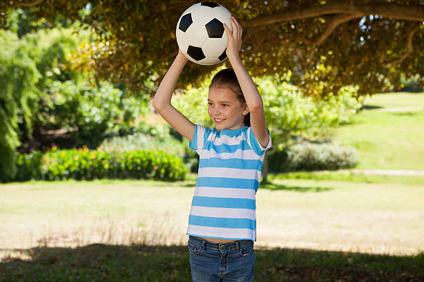 istock Cute little girl holding ball 480868892
