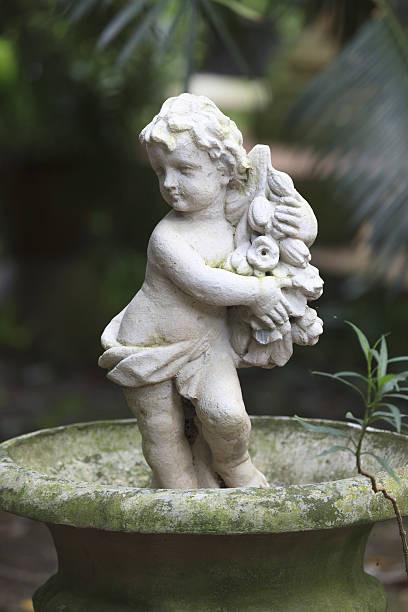 istock Cupid Statue sculpture in the garden. 480871586