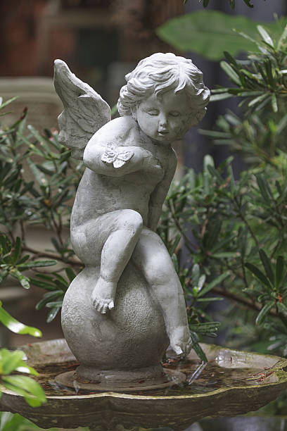 istock Cupid Sculpture Statue in garden. 480871598