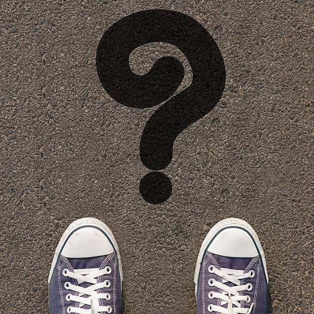 istock Pair of shoes standing on a road with icon 480872435