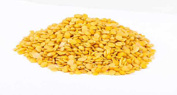 istock Yellow lentils isolated on white background.Macro shot 480874087
