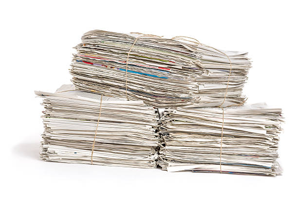 istock Bundles of newspapers on a white background 480877088