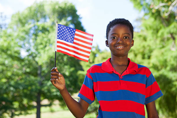 istock Little boy waving american flag 480877170