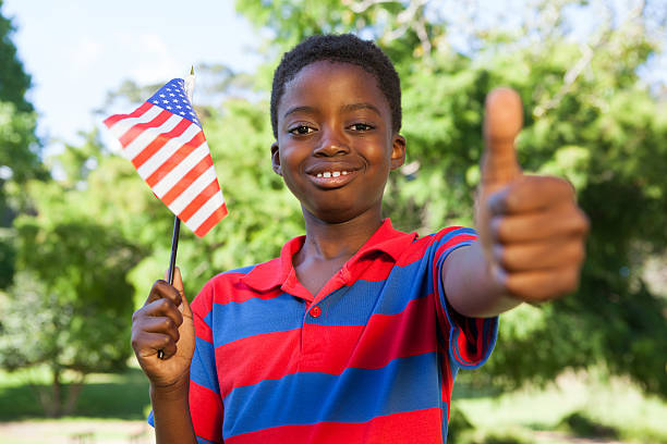 istock Little boy waving american flag 480877172