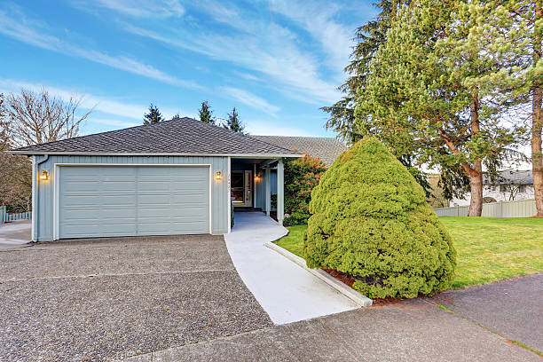 istock small blue house with garage and walkway. 480877350